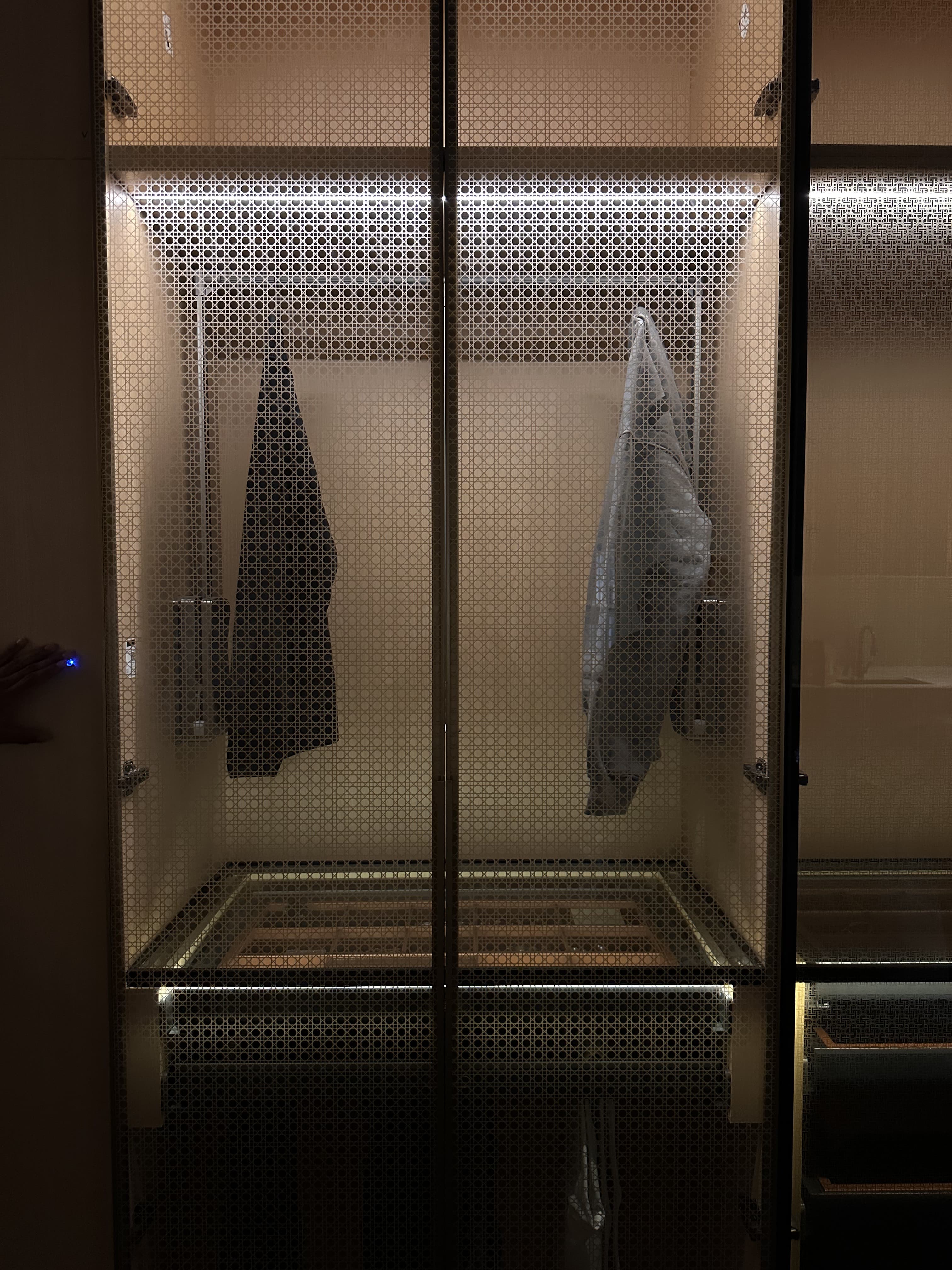 Perforated glass wardrobe doors with internal lighting